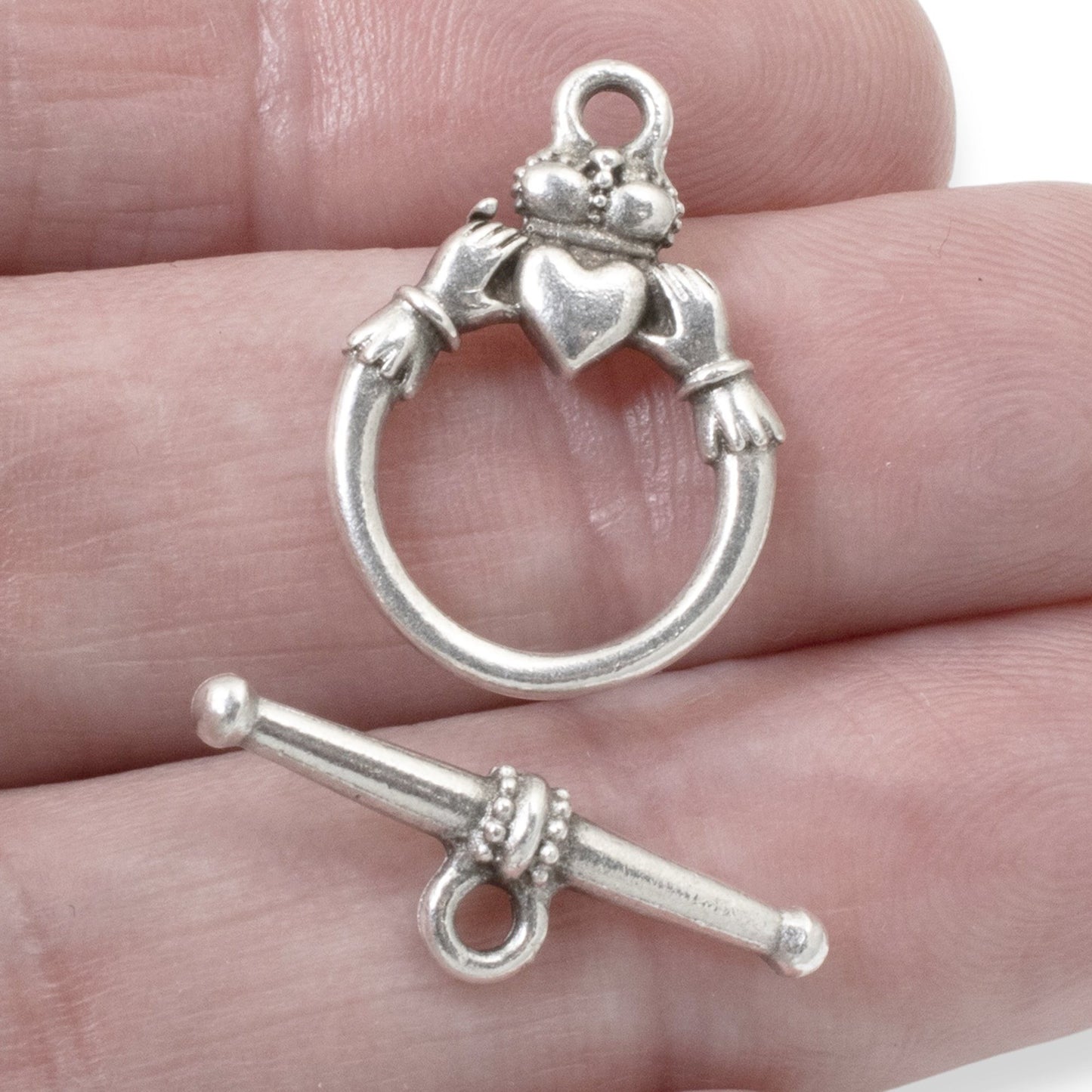 Hackberry Creek antique silver Claddagh toggle clasp set for jewelry making. Features a ring with hands holding a heart and crown, and a bar closure.