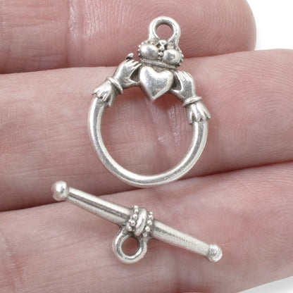Hackberry Creek antique silver Claddagh toggle clasp set for jewelry making. Features a ring with hands holding a heart and crown, and a bar closure.