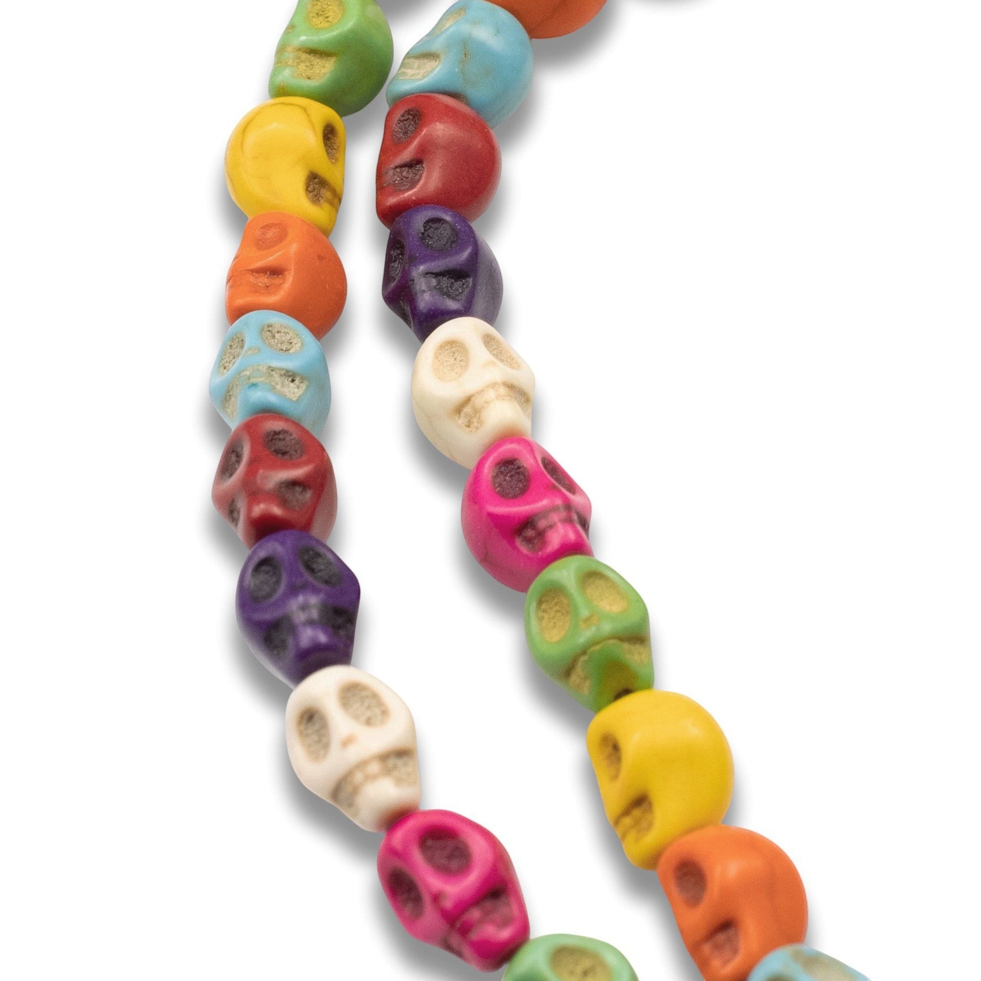 Hackberry Creek colorful magnesite skull beads on a 15-inch strand for DIY Halloween and Day of the Dead jewelry.