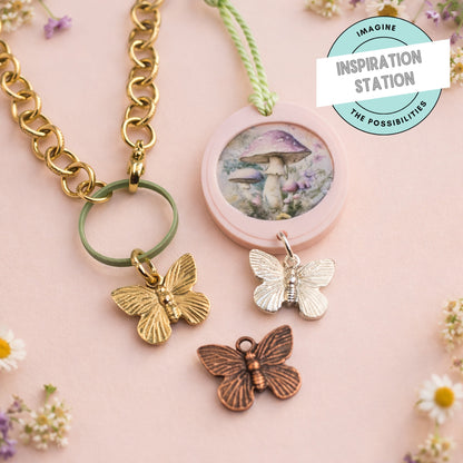 Hackberry Creek antique copper butterfly charms featuring detailed wing designs for rustic jewelry making.