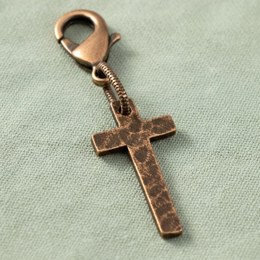 Hackberry Creek copper cross charm with distressed finish and lobster clasp for bracelets or zipper pulls.