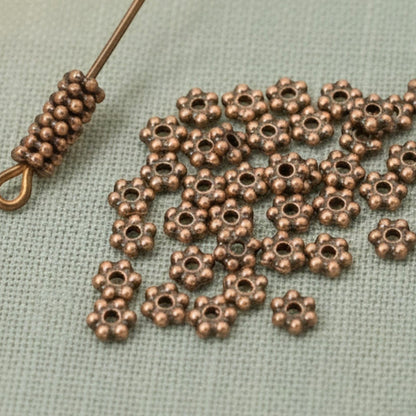 Hackberry Creek antique copper 3mm daisy spacer beads, 500 bulk pack, pewter with copper plating, TierraCast design.