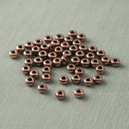 Hackberry Creek 50 copper antique 3mm smooth heishi disk spacer beads for jewelry making.