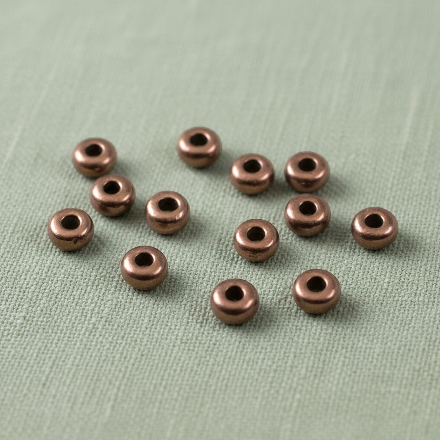 Hackberry Creek 50 antique copper 3mm smooth heishi spacer beads for jewelry making. TierraCast, Made in Greece.