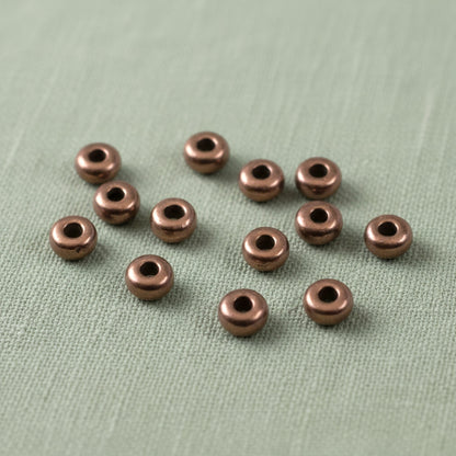 Hackberry Creek 50 antique copper 3mm smooth heishi spacer beads for jewelry making. TierraCast, Made in Greece.