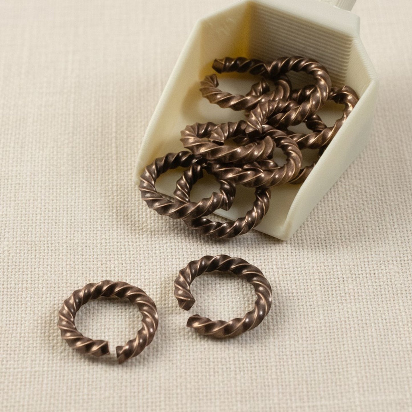 Hackberry Creek antique copper twisted rope jump rings, 14 gauge, 11.3mm outside diameter, 10 pack.