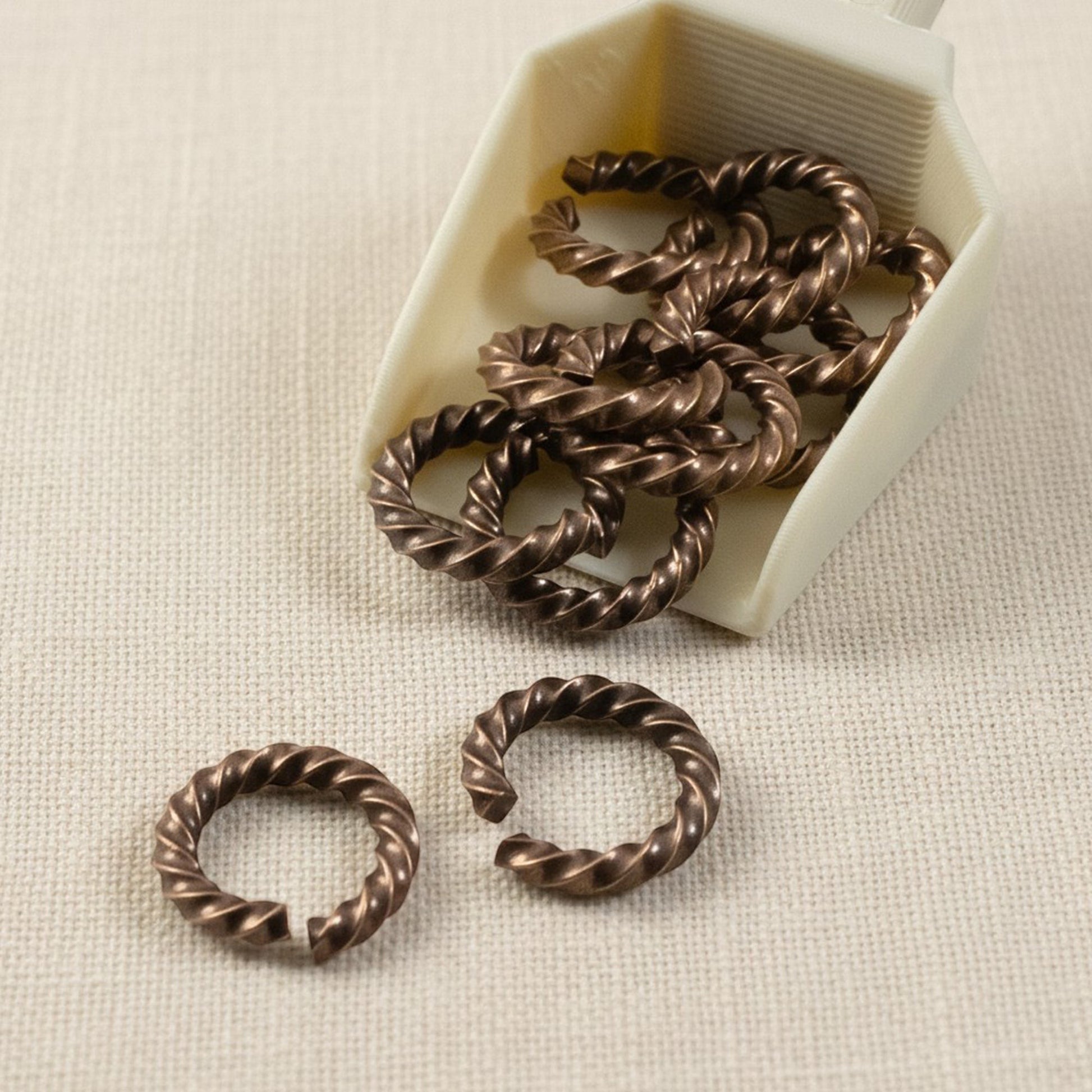 Hackberry Creek antique copper twisted rope jump rings, 14 gauge, 11.3mm outside diameter, 10 pack.