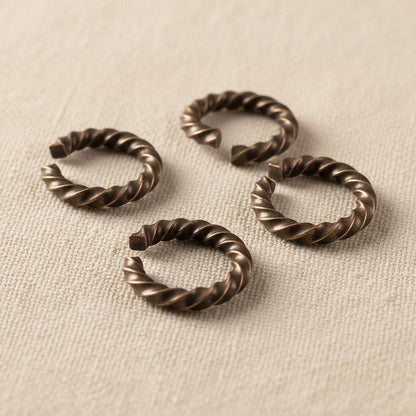 Hackberry Creek antique copper twisted rope jump rings, 14 gauge, 11.3mm outside diameter, 10 pack. Ideal for jewelry making.