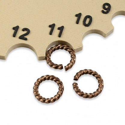 Hackberry Creek antique copper twisted rope jump rings, 14 gauge, 11.3mm outside diameter, 10 pack. These decorative connectors are ideal for jewelry making.