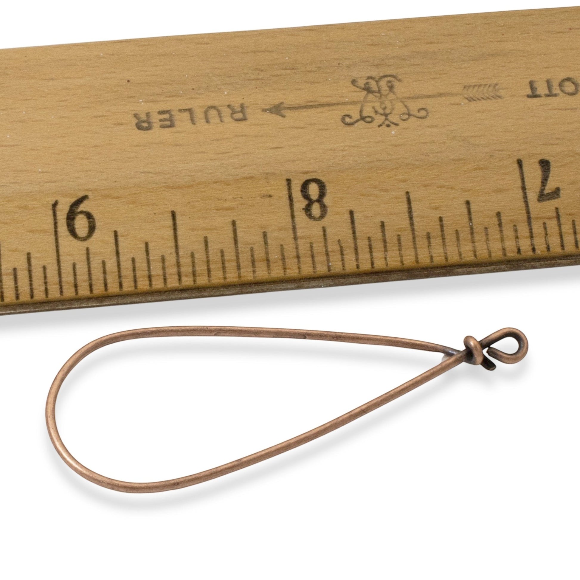 Hackberry Creek copper teardrop earring frame with 16-gauge wire, shown next to a ruler for size reference.