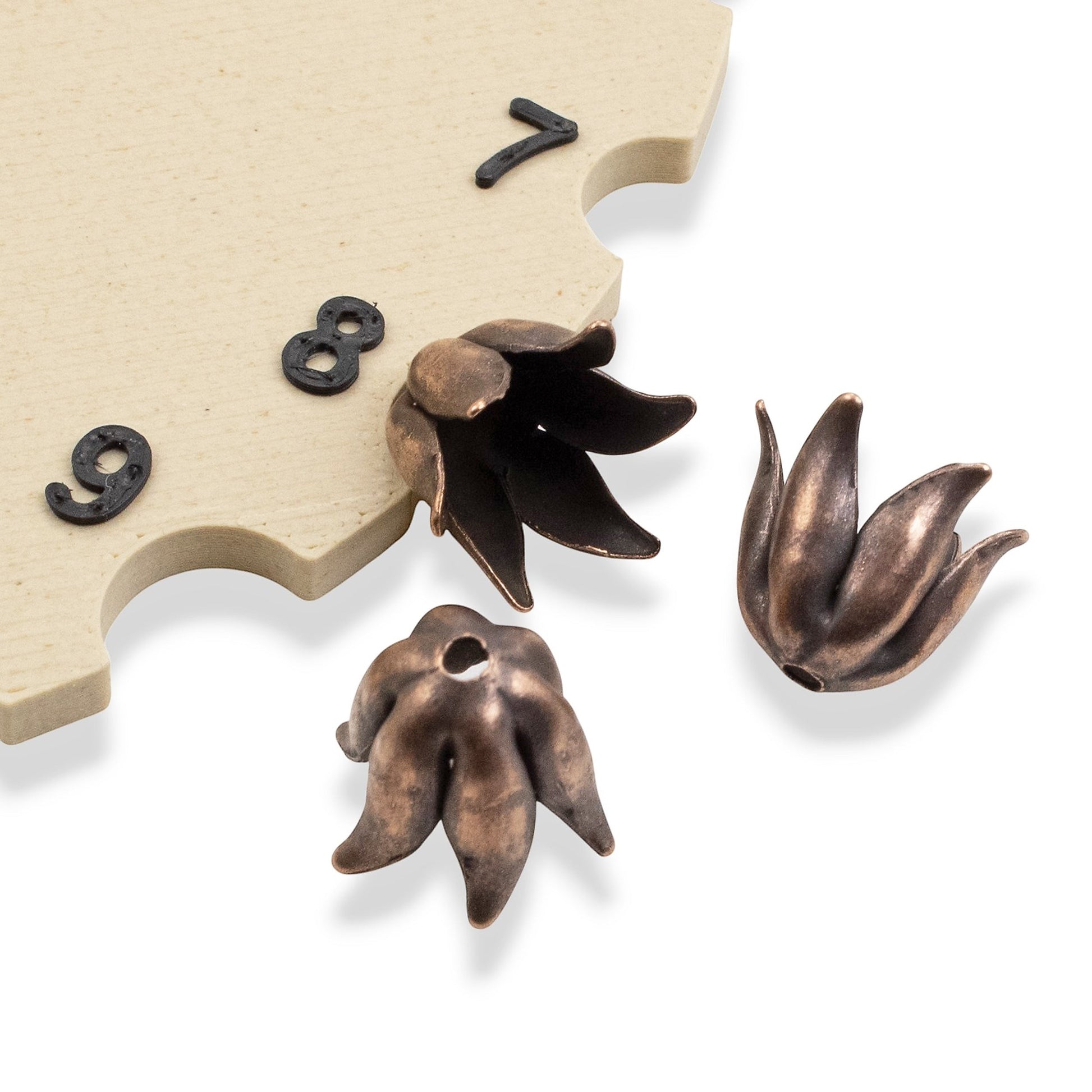 Hackberry Creek antique copper-plated pewter bead caps with a sculptural curled petal design for 8mm beads.