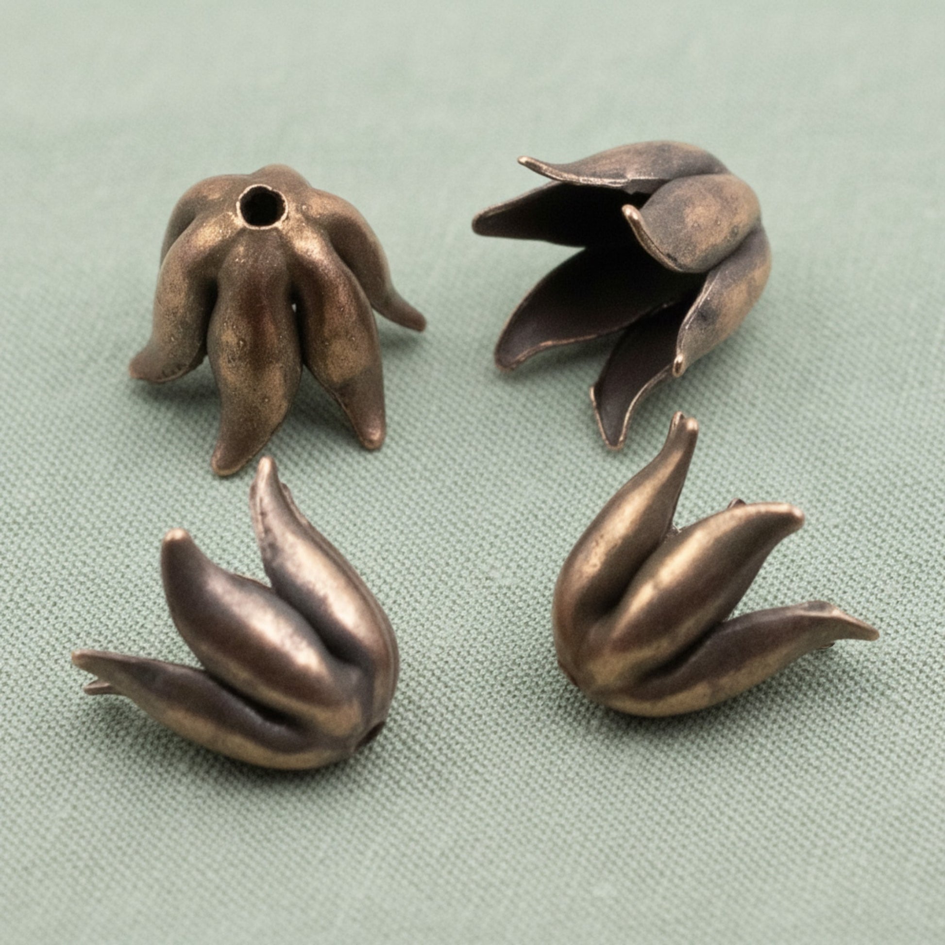 Hackberry Creek antique copper-plated pewter bead caps with a sculptural curled petal design for 8mm beads.