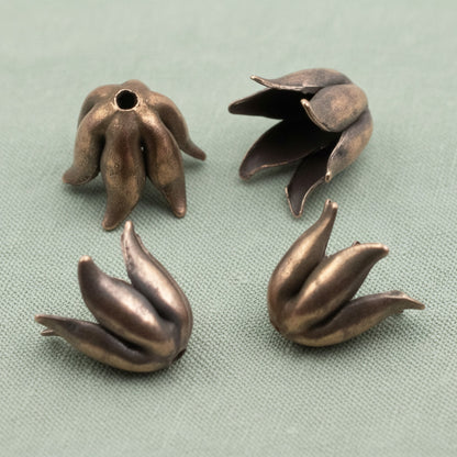 Hackberry Creek antique copper-plated pewter bead caps with a sculptural curled petal design for 8mm beads.