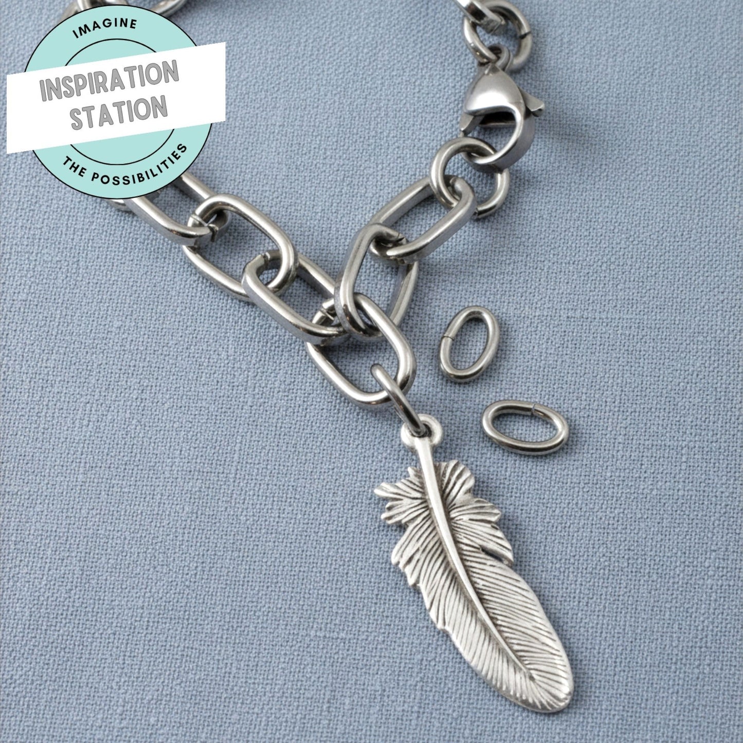 Hackberry Creek heavy duty dark silver 304 stainless steel oval jump rings used to attach a feather charm to a chain
