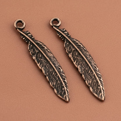 Hackberry Creek antique copper pewter feather charms, 33mm, detailed texture, boho spiritual nature jewelry.