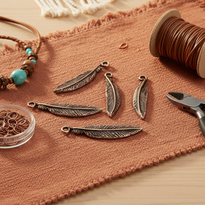 Hackberry Creek antique copper pewter feather charms, 33mm, detailed texture, for boho spiritual nature jewelry.