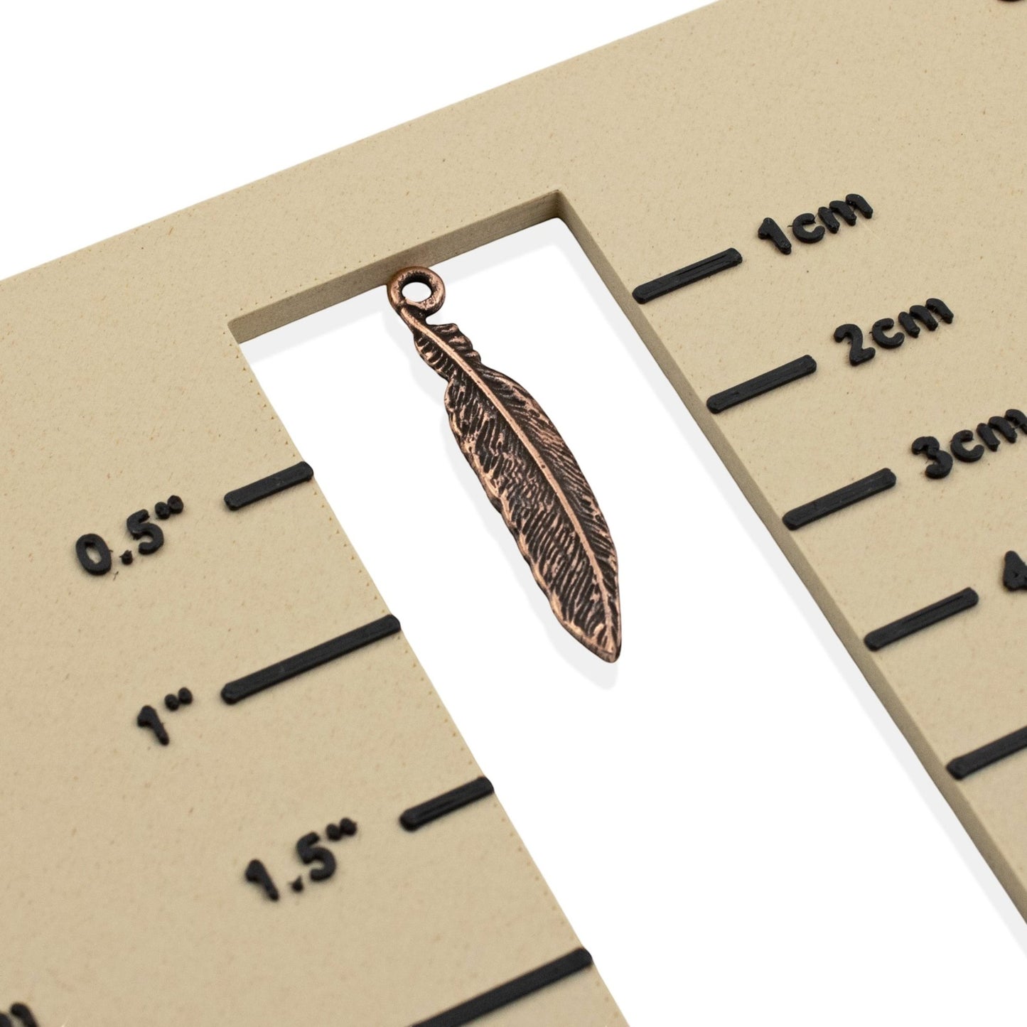 Hackberry Creek antique copper pewter feather charm, 33mm, detailed texture, for boho spiritual nature jewelry.