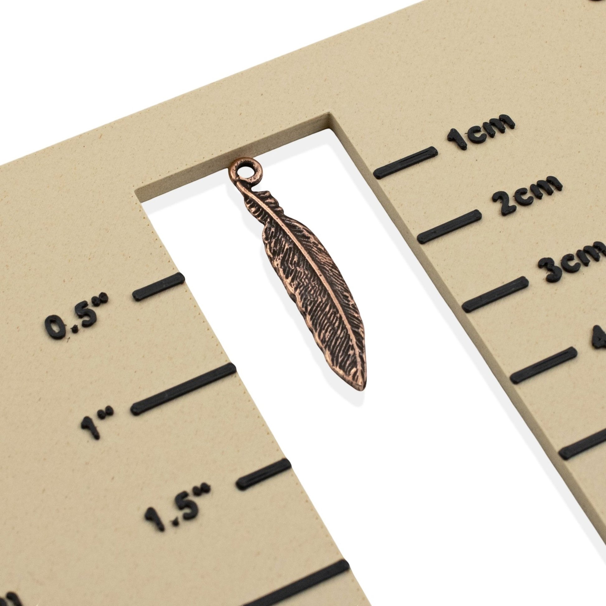 Hackberry Creek antique copper pewter feather charm, 33mm, detailed texture, for boho spiritual nature jewelry.