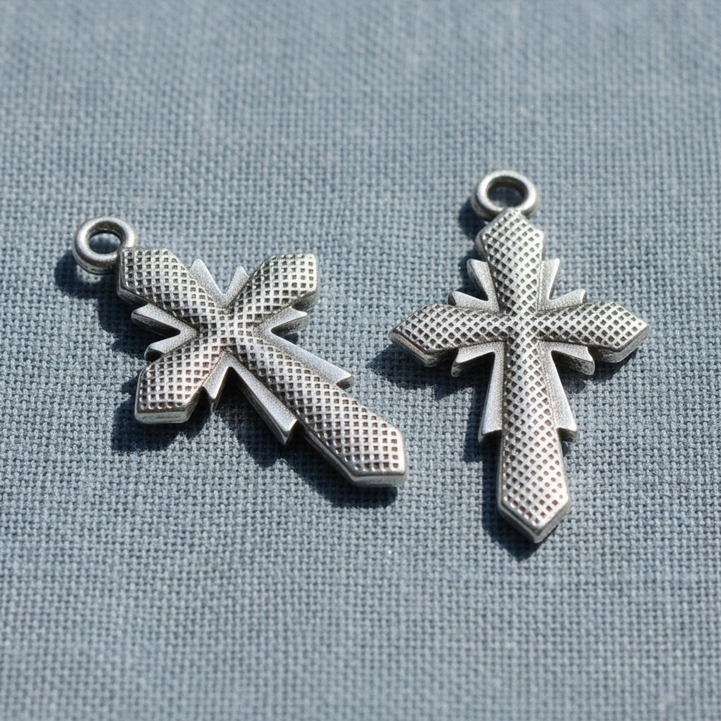 Hackberry Creek silver plated geometric cross pendants with faceted antique finish for artisan jewelry making