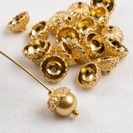 Hackberry Creek 24K gold plated acorn bead caps for jewelry making with a pearl bead on a headpin