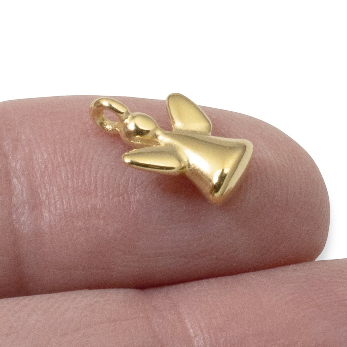 Hackberry Creek 24K gold-plated mini guardian angel charm for jewelry making, shown on a fingertip for scale.
