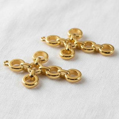 Hackberry Creek 24K gold plated cross pendants featuring an open chain-link architectural design for jewelry making.