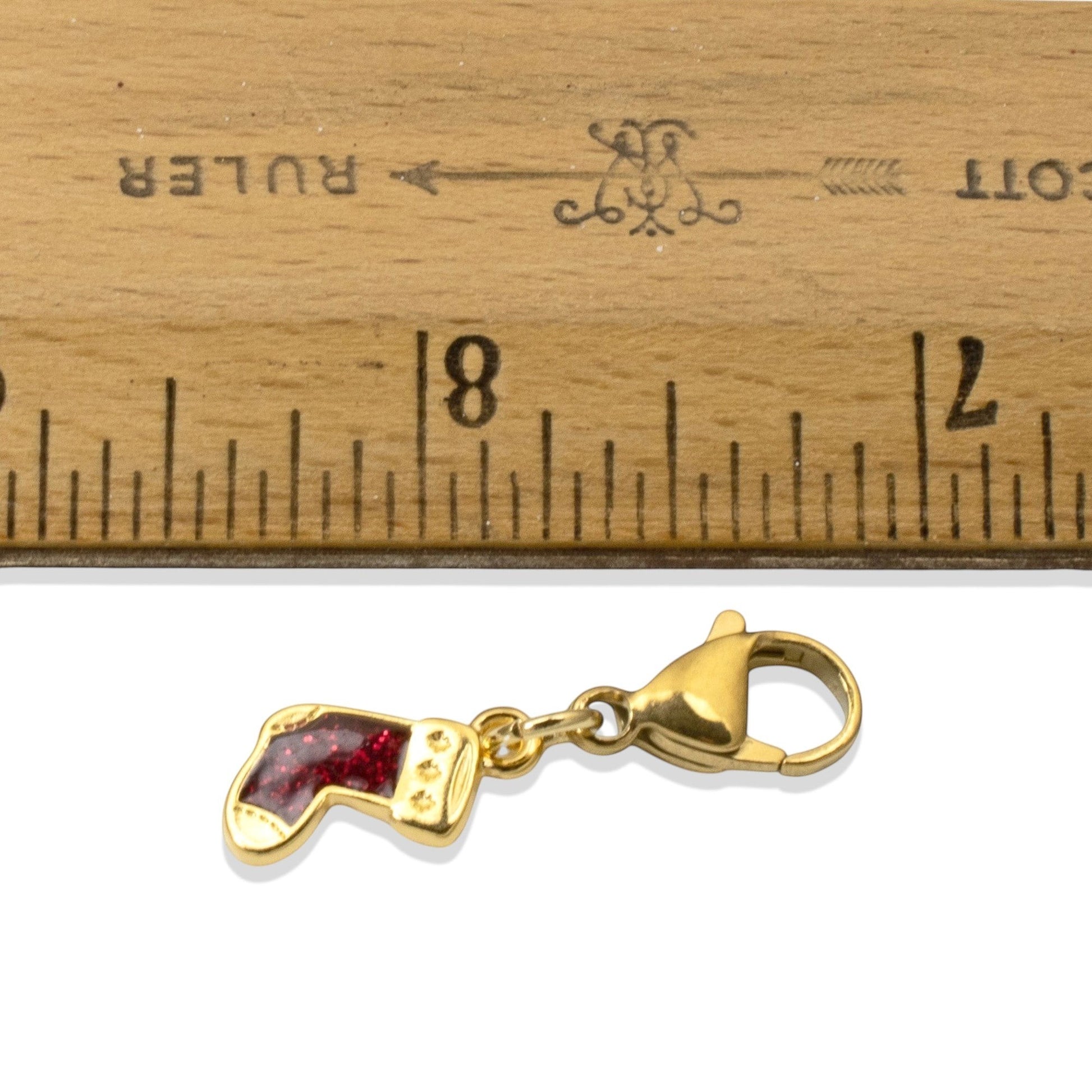 Hackberry Creek gold-plated Christmas stocking charm with red glitter enamel and a secure lobster clasp.