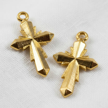 Hackberry Creek gold plated geometric cross pendants with faceted surfaces. 24K gold plated Zamak, 15x25mm.