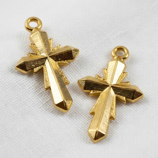 Hackberry Creek gold plated geometric cross pendants with faceted surfaces. 24K gold plated Zamak, 15x25mm.