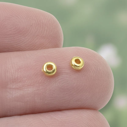 Hackberry Creek 3mm gold-plated pewter smooth disk heishi spacer beads for jewelry making.