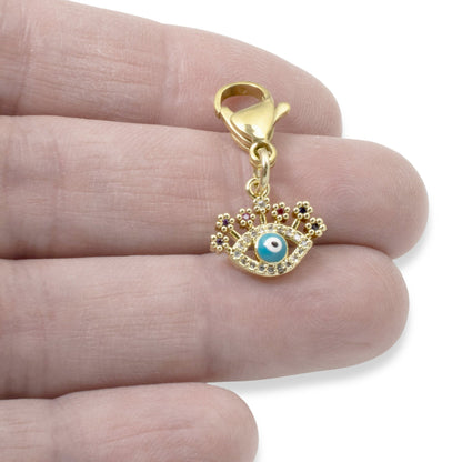 Hackberry Creek gold evil eye charm with blue enamel, clear and multi-colored CZ accents on a lobster clasp