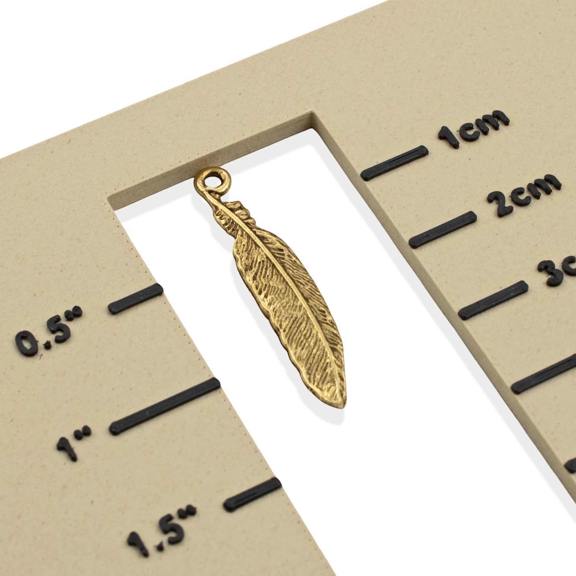 Hackberry Creek gold 24K pewter feather charm with detailed texture, 33mm. Ideal for boho and spiritual jewelry.