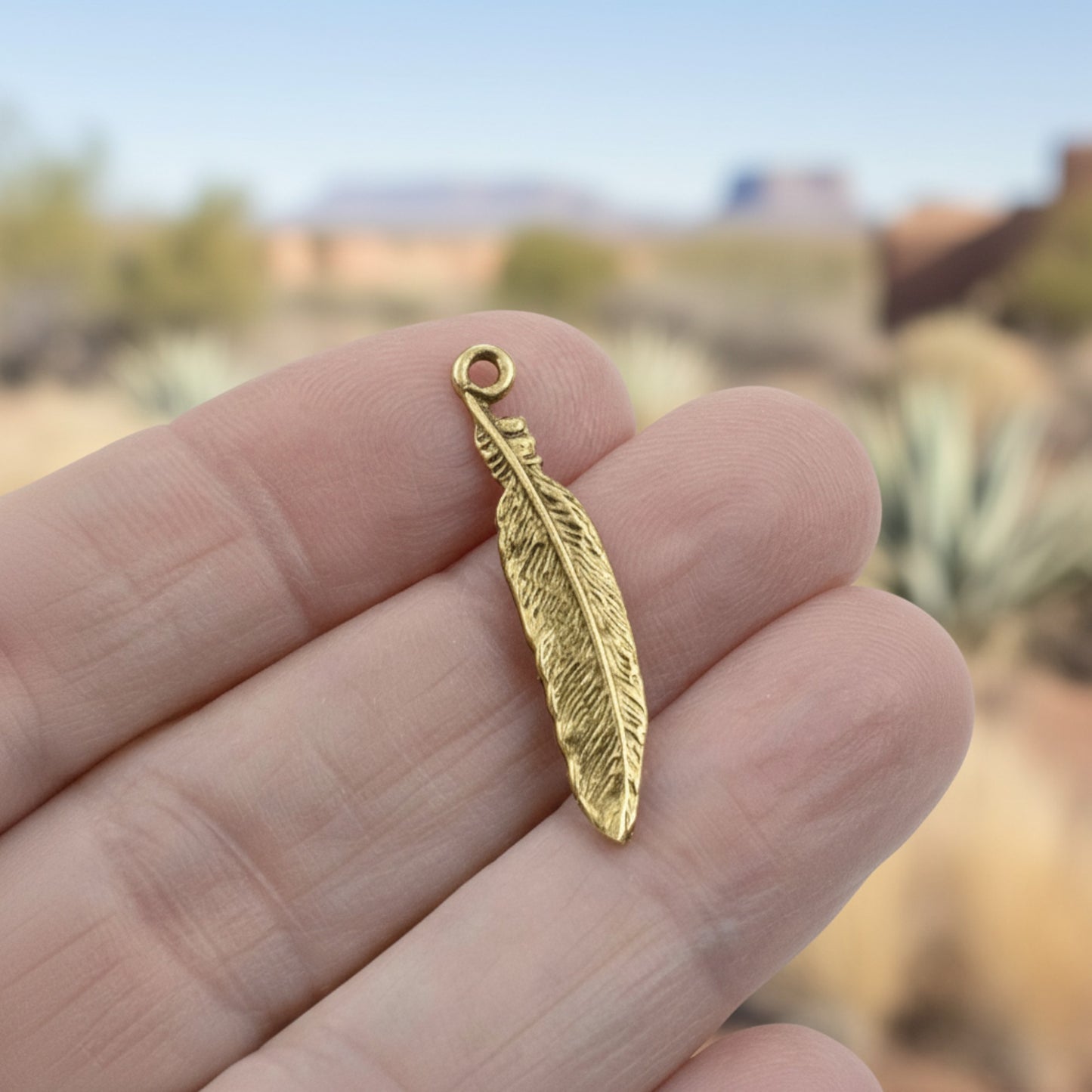 Hackberry Creek gold 24K pewter feather charm, 33mm, detailed texture, boho spiritual nature jewelry.