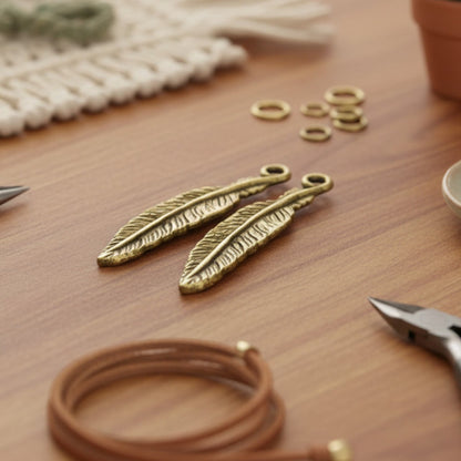 Hackberry Creek 24K gold finish pewter feather charms with intricate detail, 33mm, for boho spiritual jewelry.