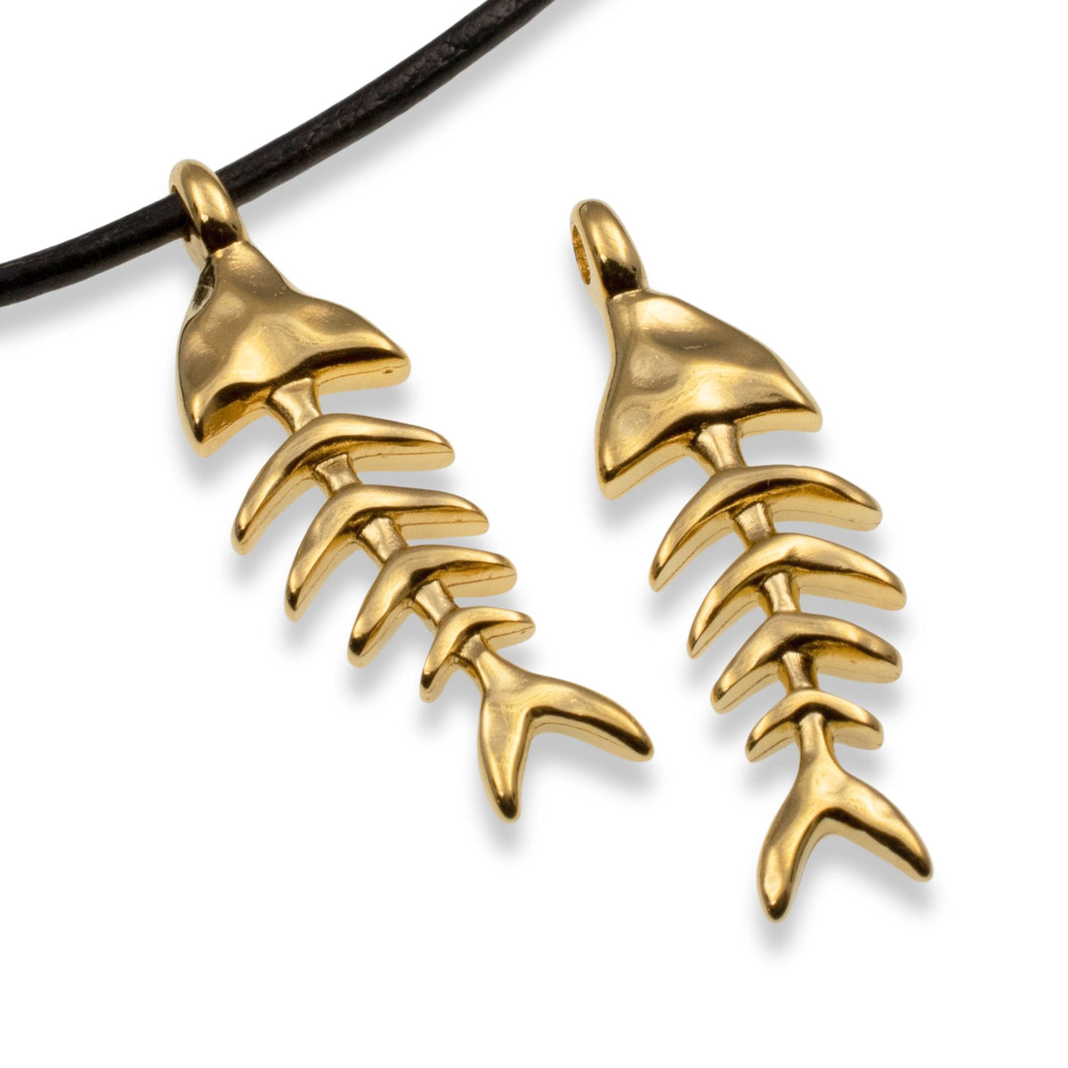 Hackberry Creek 24k gold-plated fishbone skeleton pendants with detailed texture on a black cord.