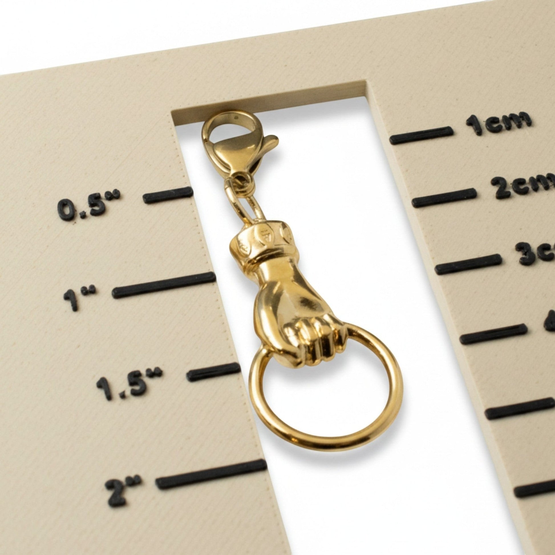 Hackberry Creek 24K gold plated Zamak hand charm with ring holder and lobster clasp. Boho style.