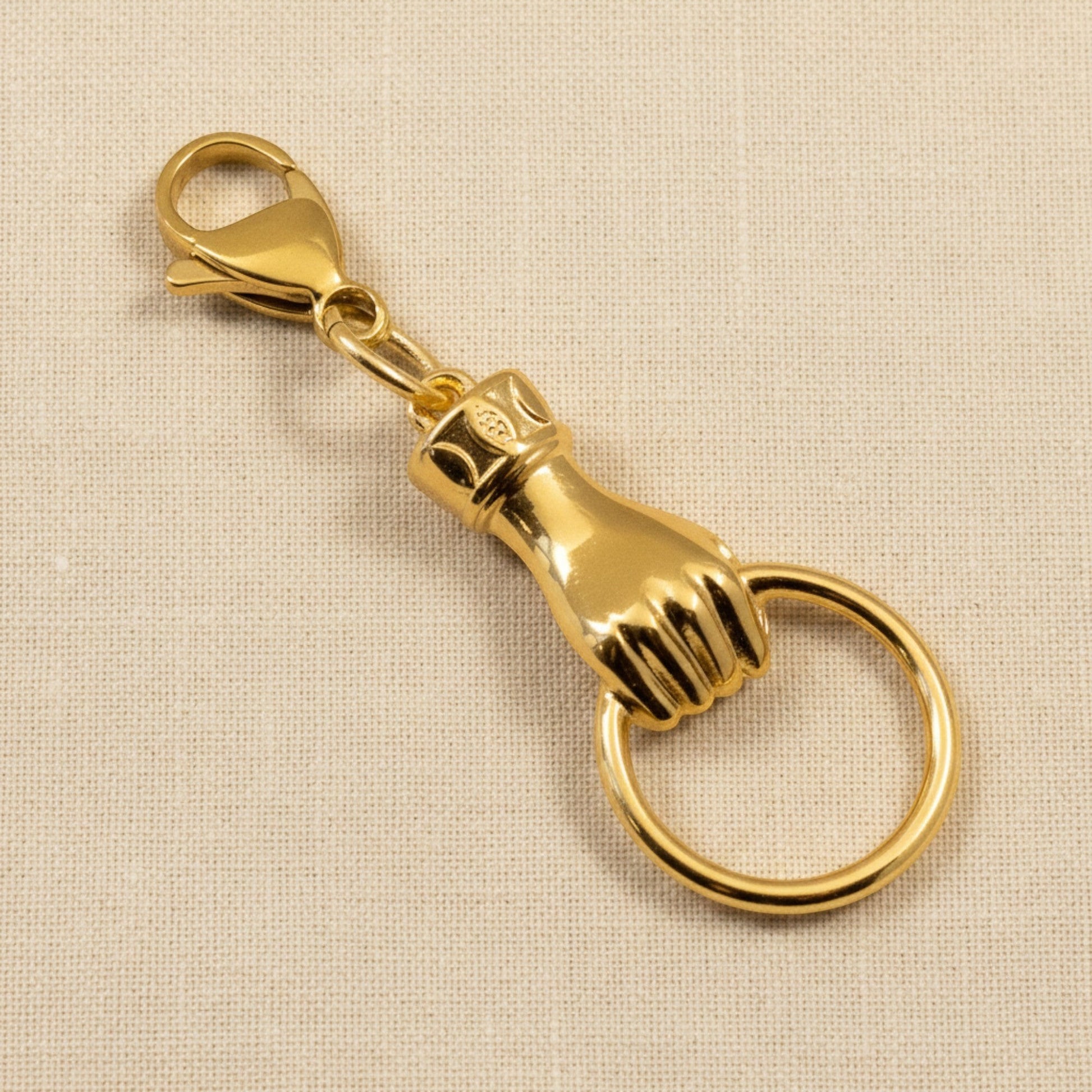 Hackberry Creek gold plated hand charm with ring holder, 24K gold finish, boho style.