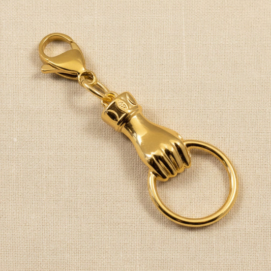 Hackberry Creek gold plated hand charm with ring holder, 24K gold finish, boho style.
