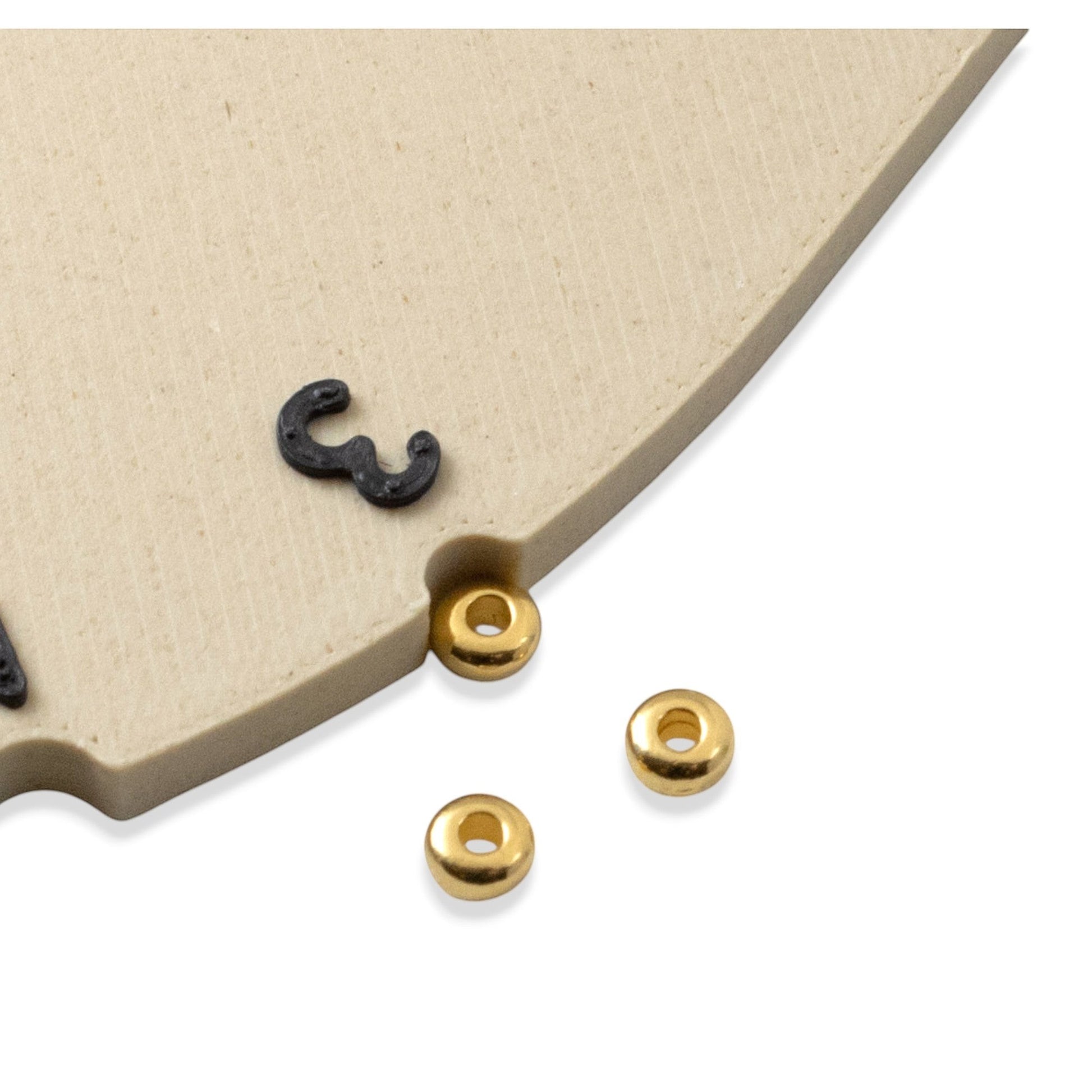 Hackberry Creek 3mm gold heishi disc spacer beads made of 24K-plated pewter. Smooth, round, and bright gold.