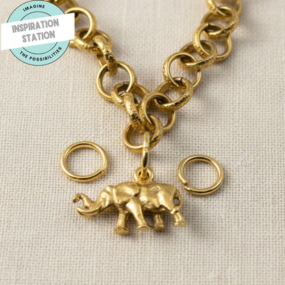 Hackberry Creek 9mm bright gold 304 stainless steel jump rings with an attached gold elephant charm on a chain