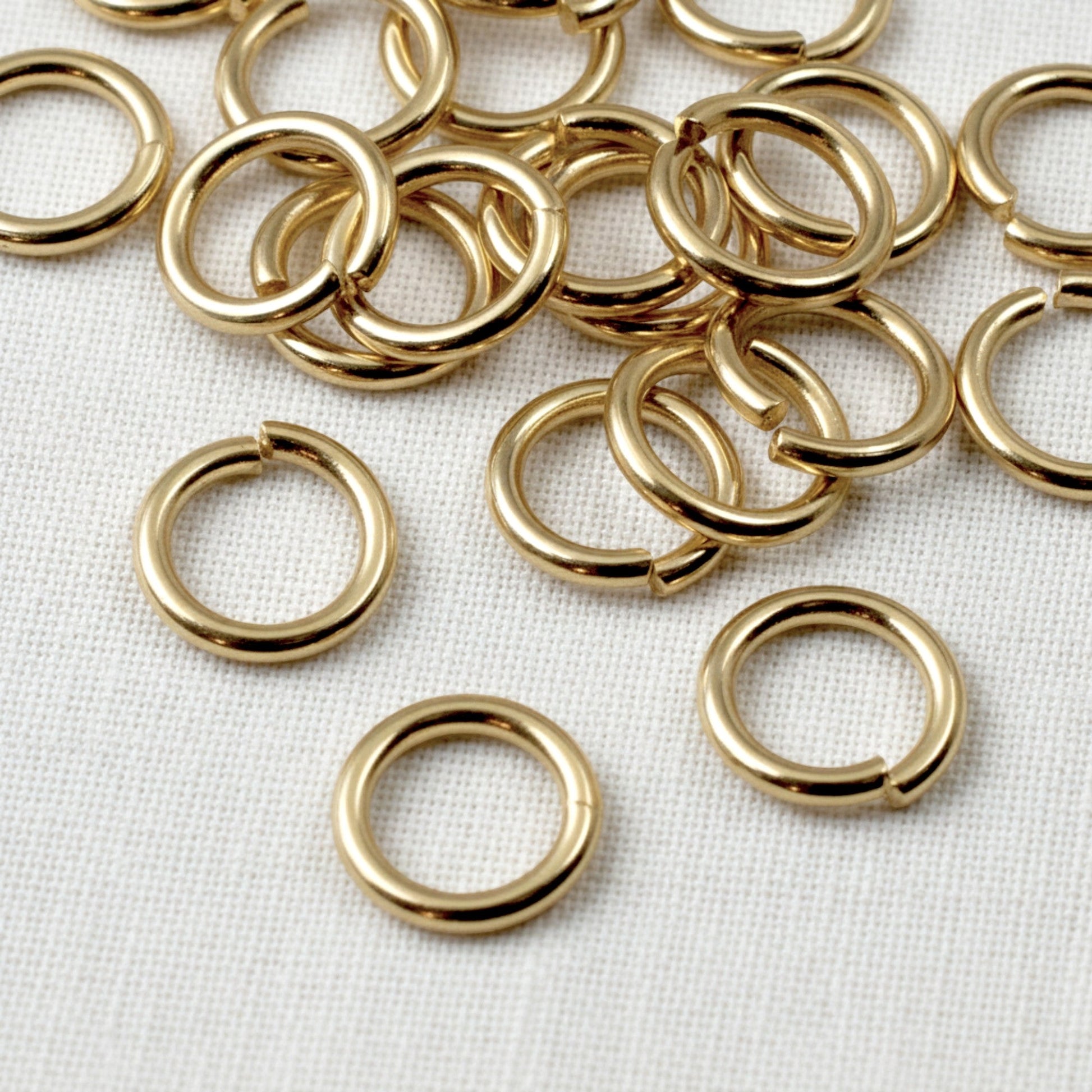 Hackberry Creek 9mm bright gold plated 304 stainless steel jump rings for jewelry making and chain maille projects.
