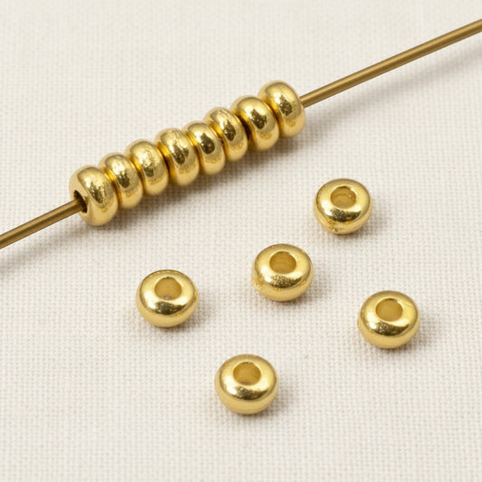 Hackberry Creek 3mm gold-plated pewter heishi spacer beads on a needle, 500 pack