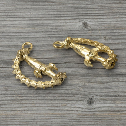 Hackberry Creek gold alloy spinning rocket charms with star-detailed arc bands for space-themed jewelry making