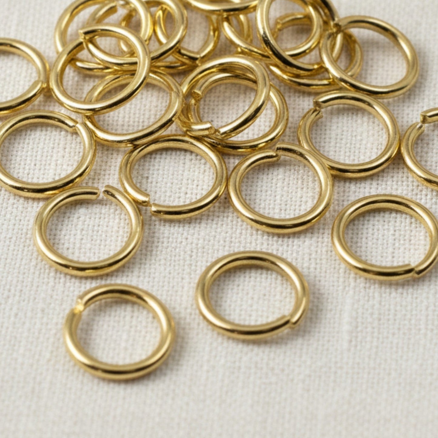 Hackberry Creek 10mm bright gold 304 stainless steel jump rings for jewelry making and chunky chain connections.