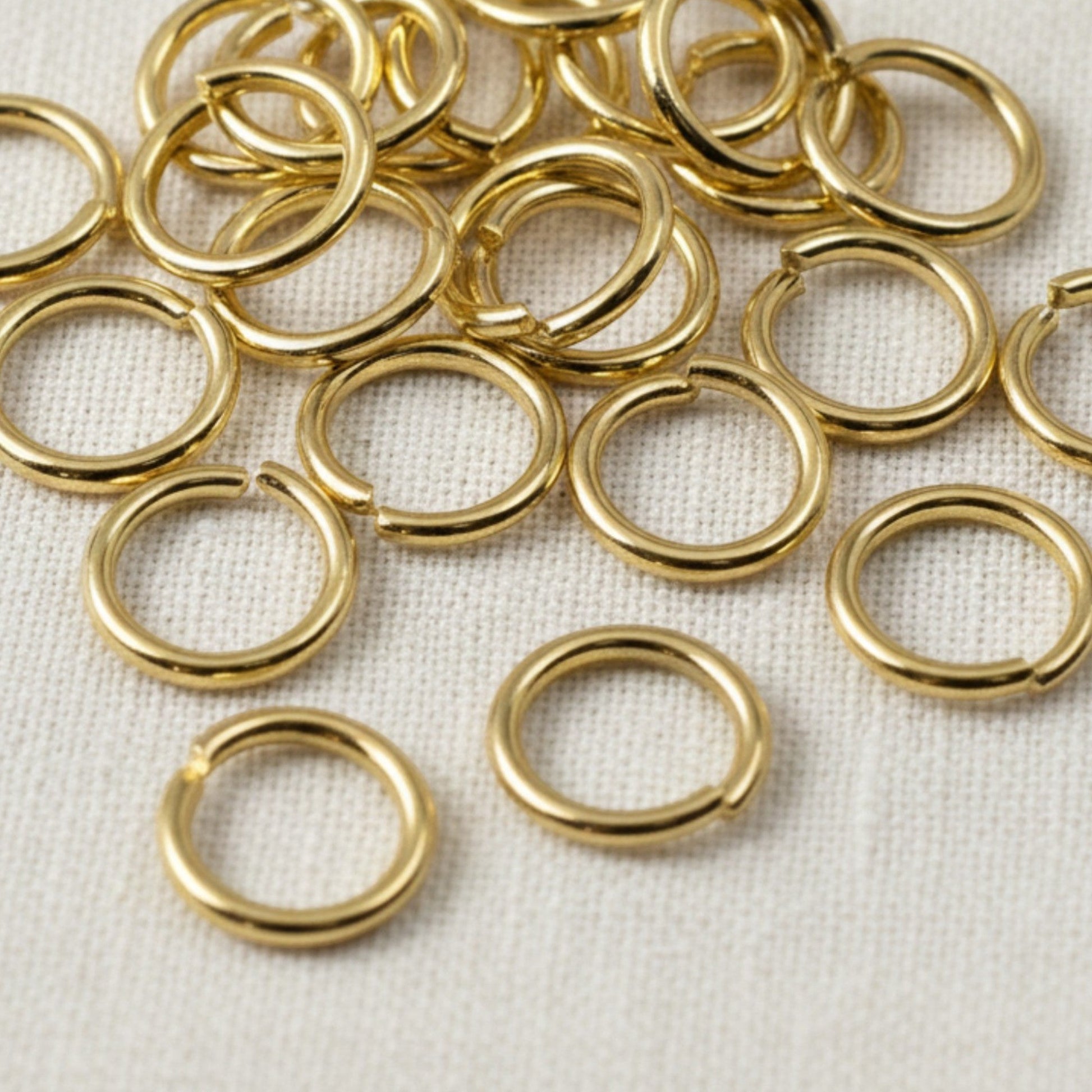 Hackberry Creek 10mm bright gold 304 stainless steel jump rings for jewelry making and chunky chain connections.