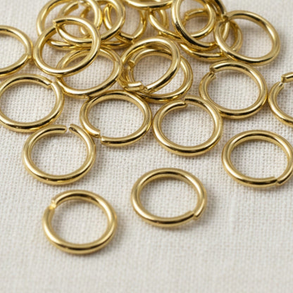 Hackberry Creek 10mm bright gold 304 stainless steel jump rings for jewelry making and chunky chain connections.