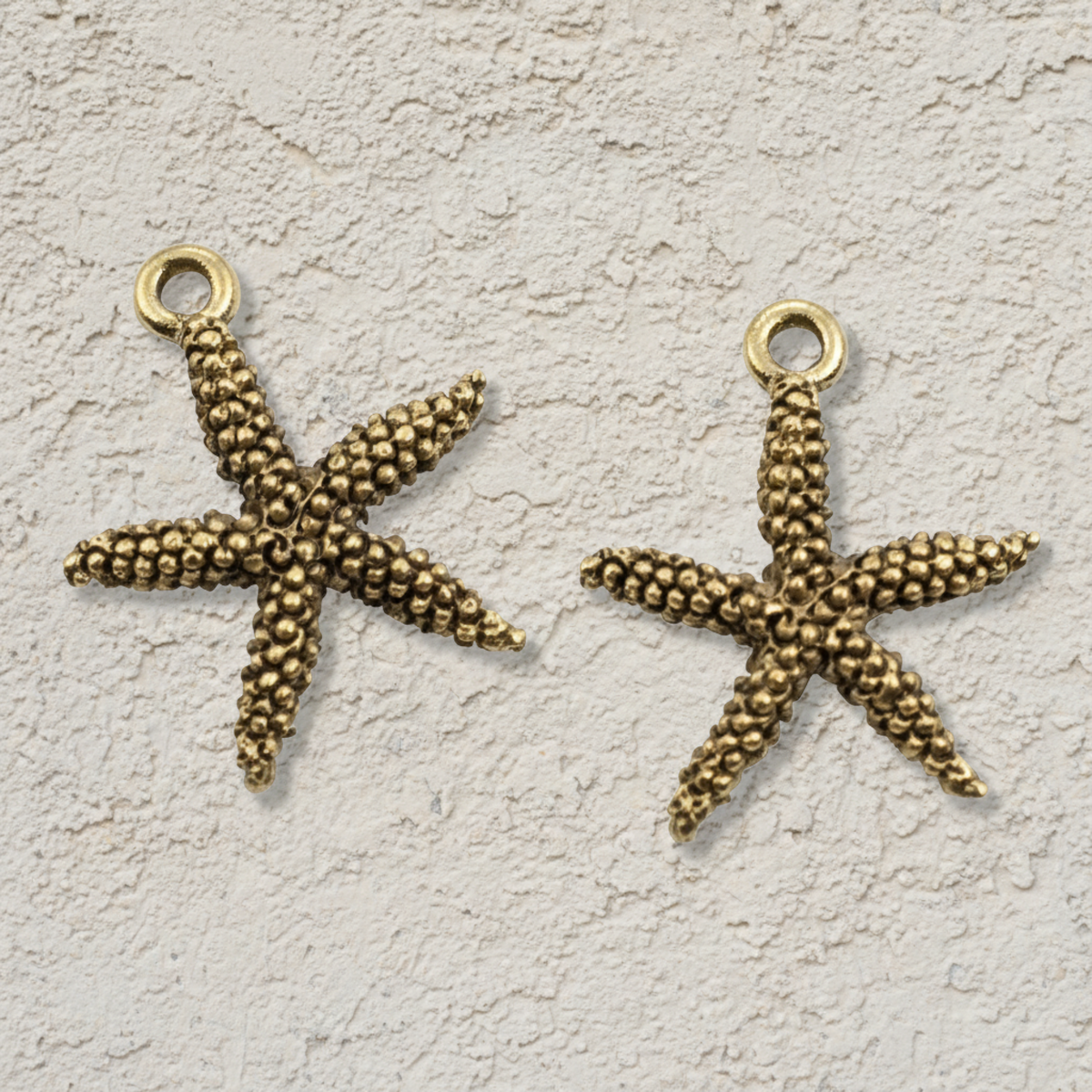Hackberry Creek antique gold pewter starfish charms with detailed texture for coastal jewelry making