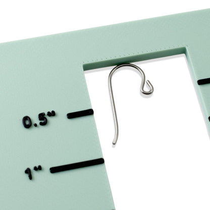 Hackberry Creek gray niobium French hook ear wires with small loops shown against a measurement gauge