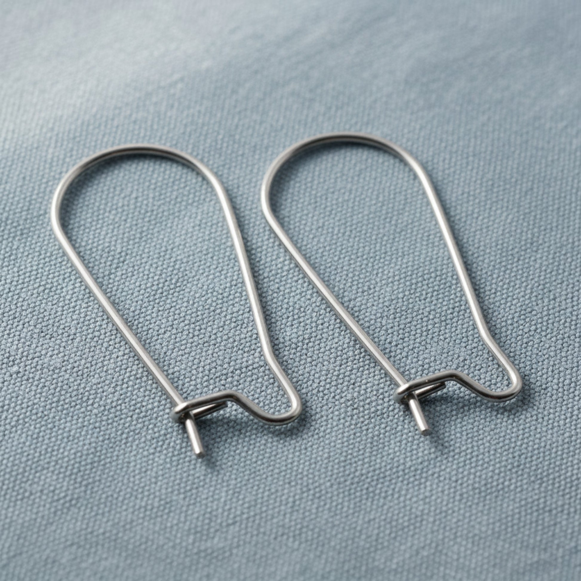 Hackberry Creek 25mm stainless steel kidney ear wires with safety hook closure, 21 gauge wire.