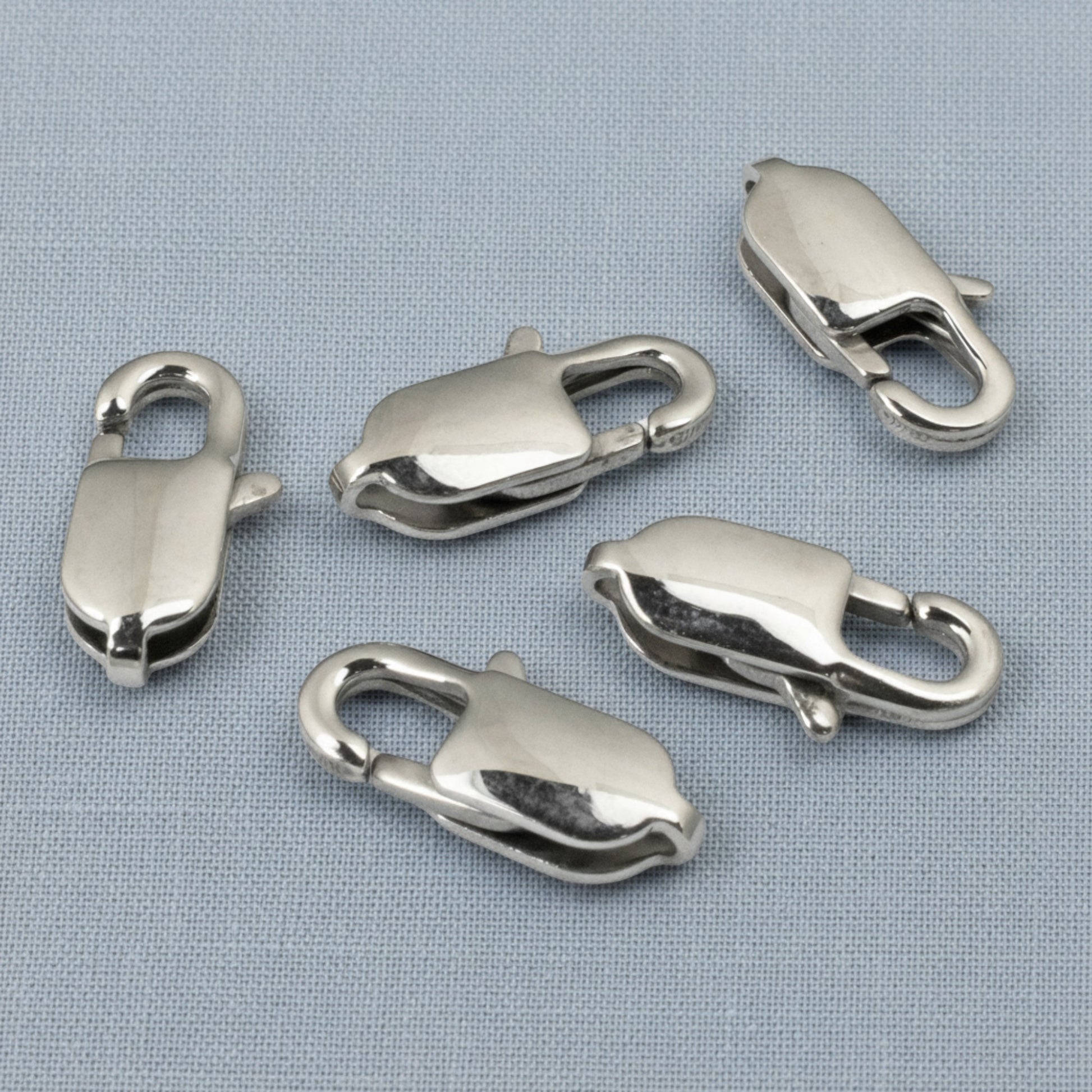 Hackberry Creek set of five large oval silver stainless steel lobster claw clasps for jewelry making.